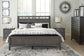 Montillan California King Panel Bed with Mirrored Dresser, Chest and 2 Nightstands